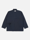 The Navy Twill Kyoto Work Jacket is displayed on a white background. The jacket is a dark navy color and made of twill material. It has a relaxed fit and features a tie closure.