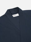 Close-up of the Navy Twill Kyoto Work Jacket on a white background. The jacket is made of twill and has a relaxed fit. The brand label is visible.