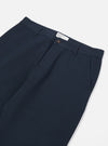 Close-up of the Navy Twill Military Chino on a white background. The twill fabric is a deep navy. Details include belt loops and front pockets.
