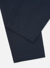 Close-up of the Navy Twill Military Chino on a white background. The twill fabric is a dark navy color, and the fit is straight. 