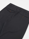 Close-up of the back of the Black Twill Curved Pant on a white background, showing the pockets with button closures.