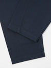 Close-up of the Navy Twill Curved Pant on a white background, showcasing the fabric's texture and the curved seam detail.