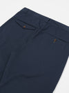 Close-up of the back of the Navy Twill Curved Pant on a white background, showing the twill texture and buttoned pockets.