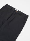 Close-up of the Black Twill Aston Pant on a white background. The twill fabric is visible, showcasing the fit and material.