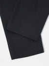 Close-up of the Black Twill Aston Pant on a white surface. The dark twill fabric shows a subtle texture and clean hem.