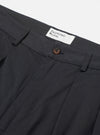Close-up of the Black Twill Double Pleat Pant on a white background. Details include the pleats, button, belt loops, and brand tag.