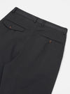 Close-up of the back of the Black Twill Double Pleat Pant on a white background, showing the pockets and belt loops.