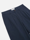 Close-up of the Navy Twill Double Pleat Pant on a white background, showcasing the fabric and pleat details.