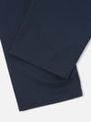 Close-up of the Navy Twill Double Pleat Pant on a white background, showing the fabric's texture and the double pleat detail.