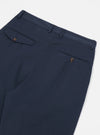 Close-up of the back of the Navy Twill Double Pleat Pant on a white background. The pants have a relaxed fit and feature double pleats and buttoned pockets.