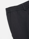 Close-up of the Black Twill Pleated Track Pant on a white background, showing the twill fabric and pleated details.