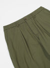 Close-up of the Light Olive Twill Pleated Track Pant on a white background. The twill fabric shows pleats and an elastic waistband with button closure.