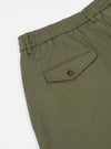 Close-up of the Light Olive Twill Pleated Track Pant on a white background, showing the elastic waistband and pocket with button.