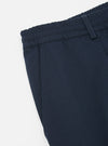 Close-up of the Navy Twill Pleated Track Pant on a white background, showcasing the twill texture, elastic waistband, and pleated design.