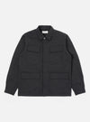 The Black Twill MW Fatigue Jacket is displayed on a white background. The jacket is dark gray and made of twill, featuring a collared neck and four front pockets.