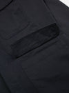 Close-up of the Black Twill MW Fatigue Jacket showing the fabric and pocket details on a white background. 