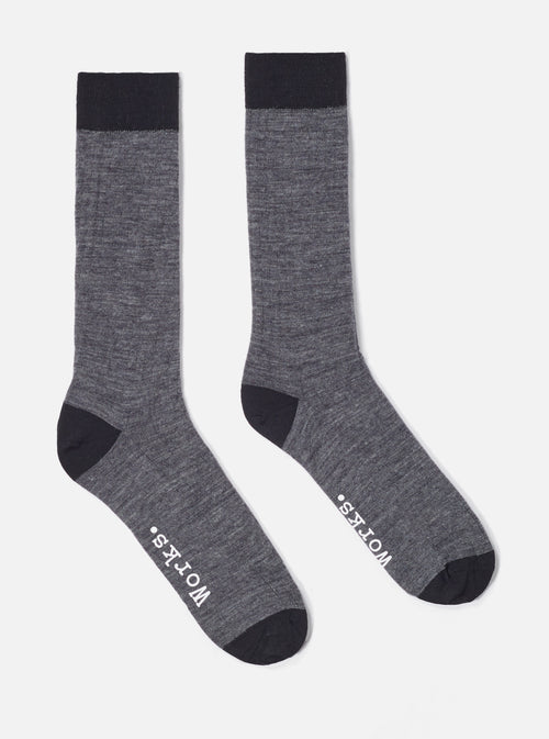 Studio shot of Grey Marl Merino Classic Sock. Merino wool socks are grey with black toe and cuff. Socks are on a white background.