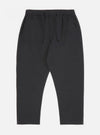 Close-up of the Black Twill Hi Water Trouser on a white background. The trousers have a relaxed fit and an elasticated waistband with a drawstring.