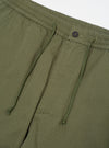 Close-up of the Light Olive Twill Hi Water Trouser on a white background. Shows the twill texture, drawstring waist, and button closure.