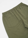 Close-up of the back of light olive twill hi water trouser on a white background. Shows the elastic waistband and back pockets.