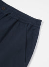 Close-up of the Navy Twill Hi Water Trouser on a white background, showing the elastic waistband, drawstring, and pocket detail.