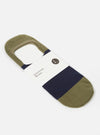 Close-up of the Navy/Olive Cotton Mix Knit No Show Sock on a white surface. The sock features navy and olive stripes and is made of a soft cotton knit.