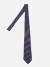 Close-up of a Navy Dot Print Tie on a white background. The tie is navy with white dots.